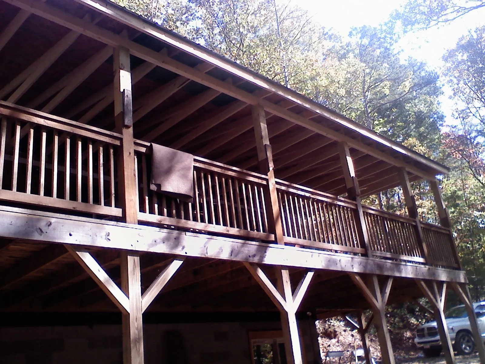 Timber framing under a new elevated porch and deck — Roof Leak Repair in La Fontaine by Roofing Brothers